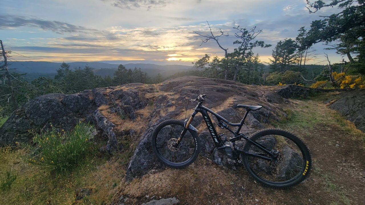 Mountain bike overlooking a sunset ridge view
